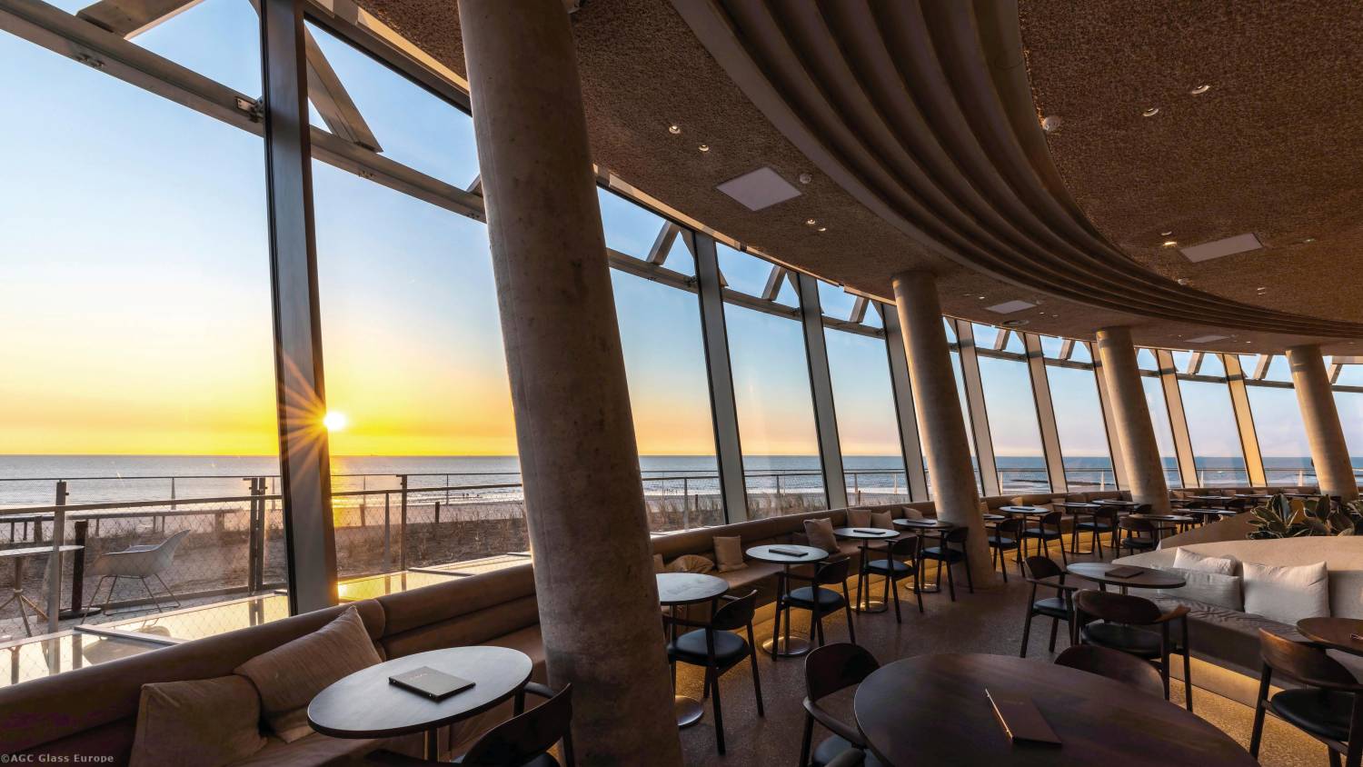 Glazed building indoor view at sunset